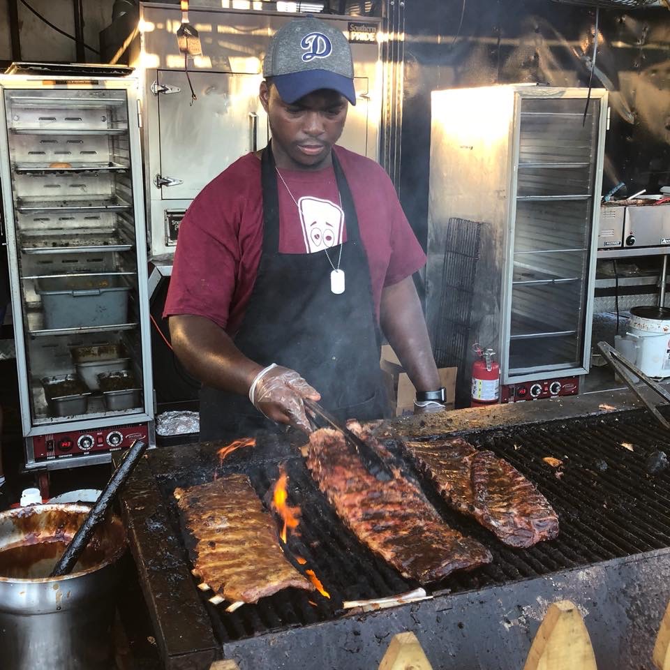 pete at bbq event grilling ribs man at grill cooking barbeque